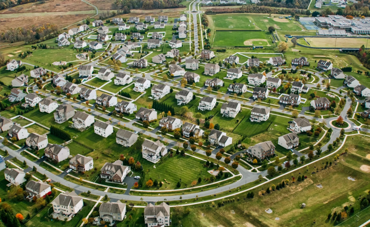 Aerial view of suburban neighborhood and roads.