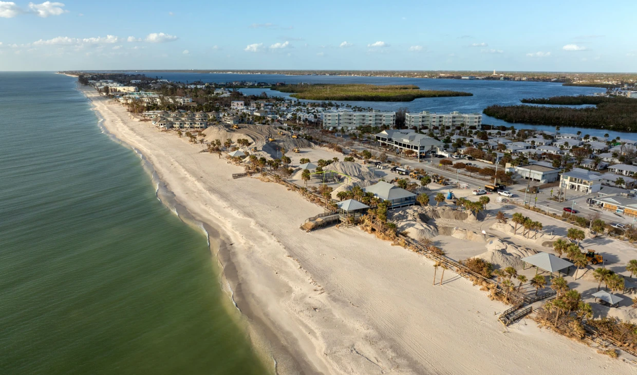 Coastal beach town with sandy shoreline view.