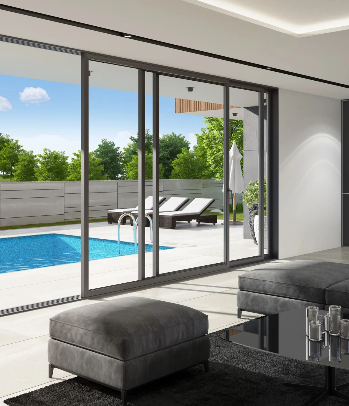 Modern living room with pool view outside.